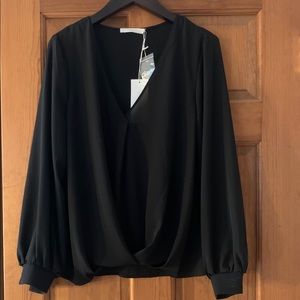 Long sleeves. Black cross cross front blouse.